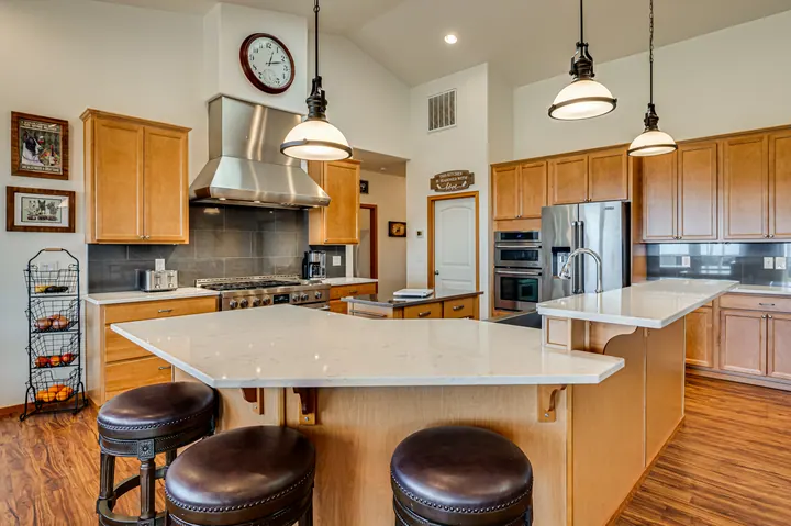 Warmly lit kitchen with a large center island