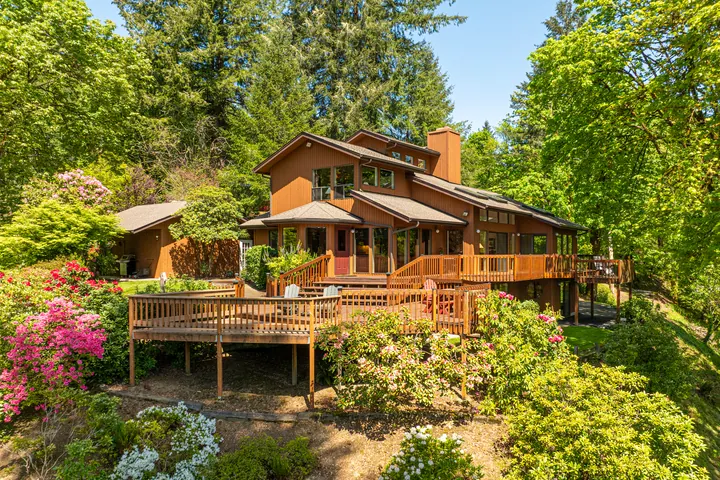 Wood-clad home surrounded by trees