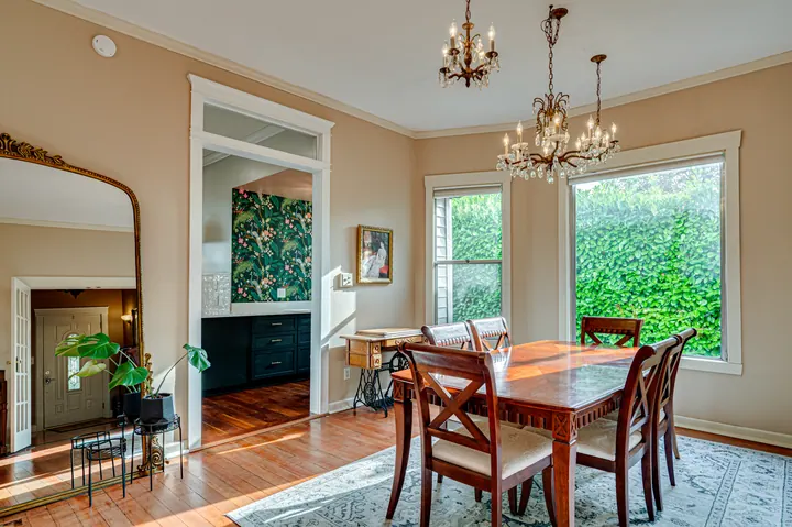 Dining room opening toward a green garden