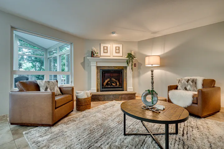Living room with a fireplace and picture window