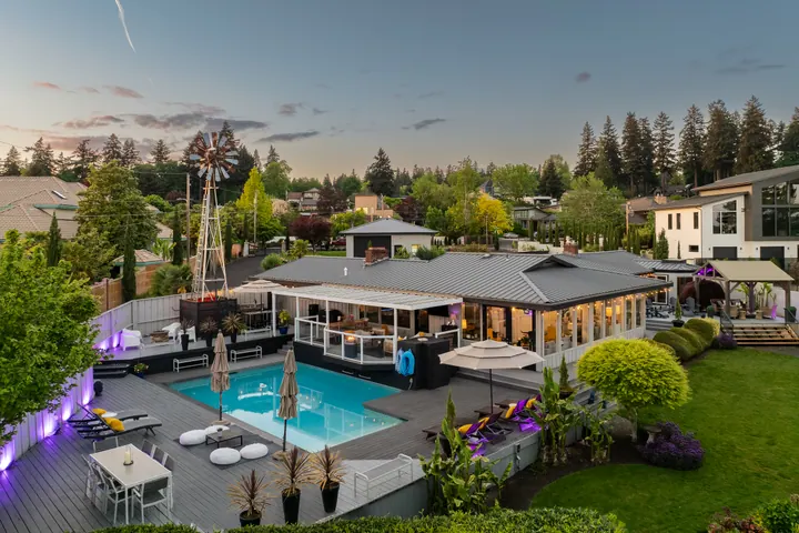 Home and pool photographed at twilight
