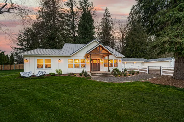 Country home with a broad lawn and trees