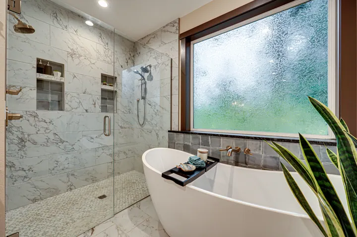 Freestanding bathtub in a light-filled bathroom