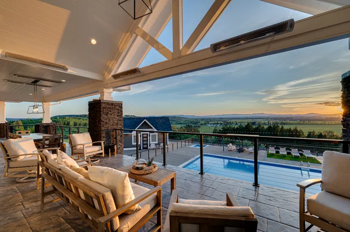 Indoor-outdoor living space overlooking a pool